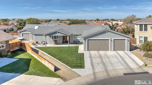 ranch-style home with a residential view, driveway, an attached garage, and fence private yard