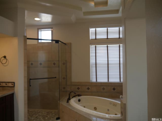 bathroom featuring a stall shower and a whirlpool tub