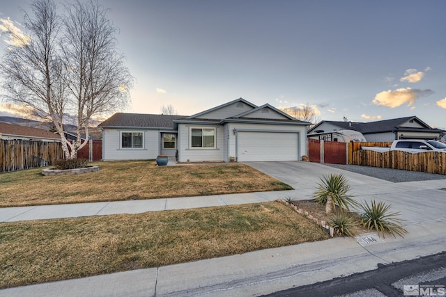 single story home with an attached garage, fence, a front lawn, and concrete driveway