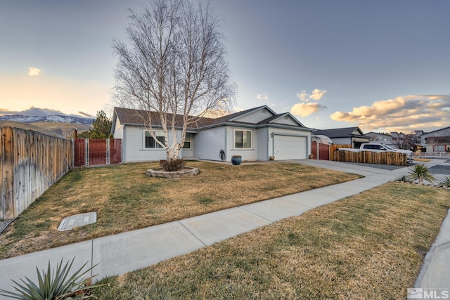 single story home with concrete driveway, an attached garage, a front yard, a gate, and fence