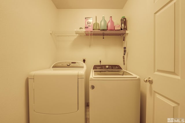 clothes washing area with laundry area and washing machine and clothes dryer