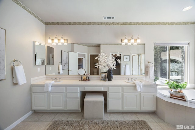 bathroom with a shower stall, visible vents, a sink, and tile patterned floors