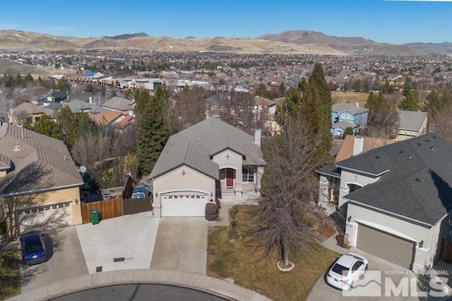 birds eye view of property featuring a residential view and a mountain view