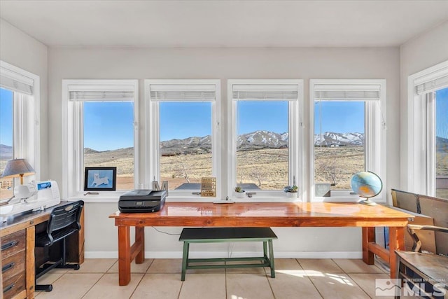 sunroom / solarium with a mountain view