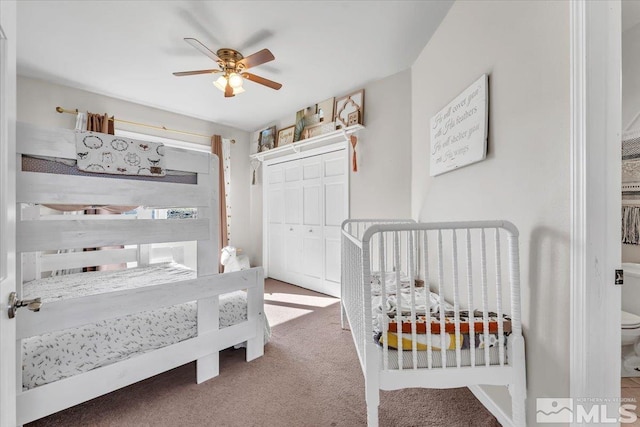 carpeted bedroom with a ceiling fan