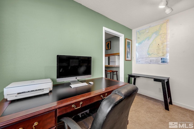 office area featuring baseboards