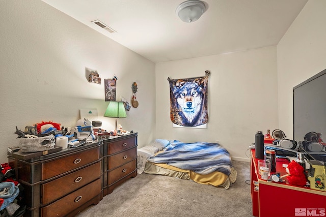 bedroom featuring carpet and visible vents