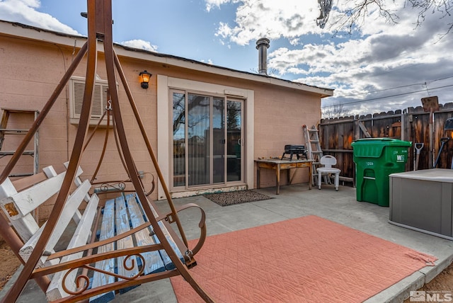 view of patio featuring fence