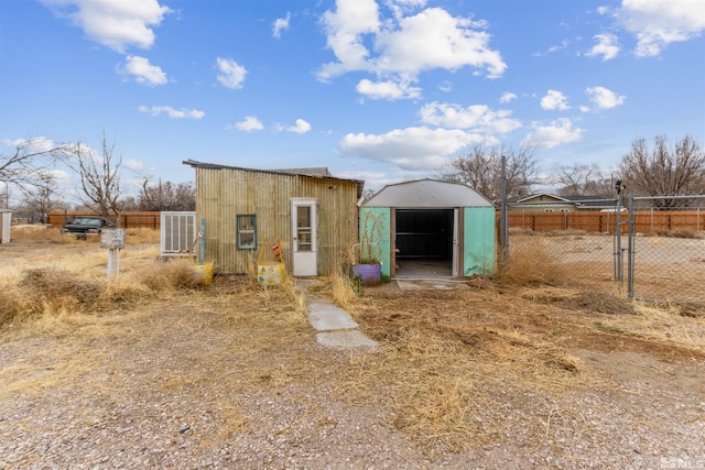 view of shed with fence