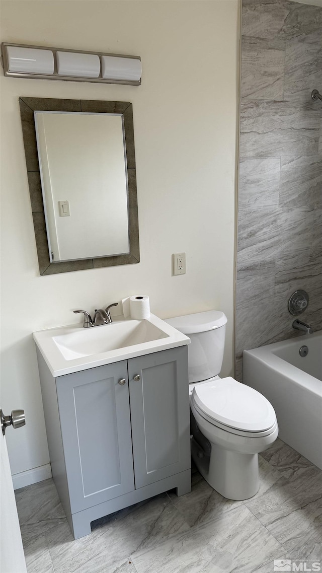 bathroom with toilet, marble finish floor,  shower combination, and vanity