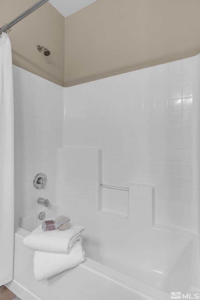 full bath featuring shower / bath combo with shower curtain