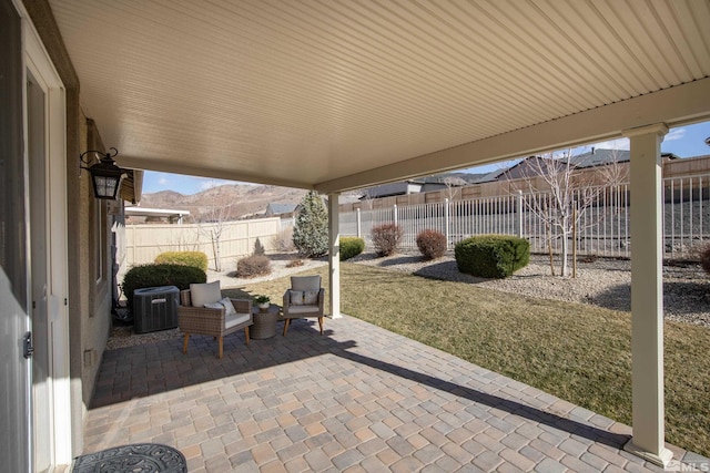 view of patio / terrace featuring a fenced backyard and central air condition unit