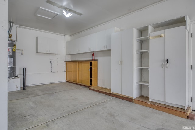 garage featuring secured water heater