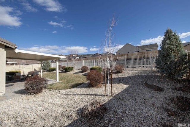 view of yard featuring a patio and fence