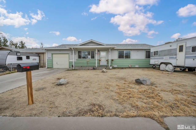 ranch-style home featuring driveway and an attached garage