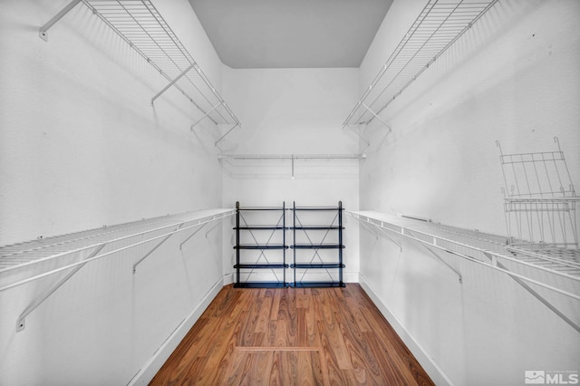 spacious closet with wood finished floors