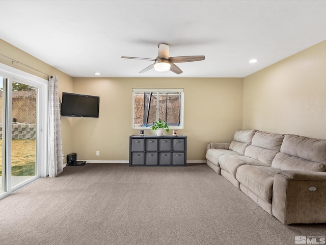 carpeted living room featuring ceiling fan, recessed lighting, and baseboards