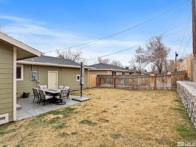 view of yard featuring a patio area and fence