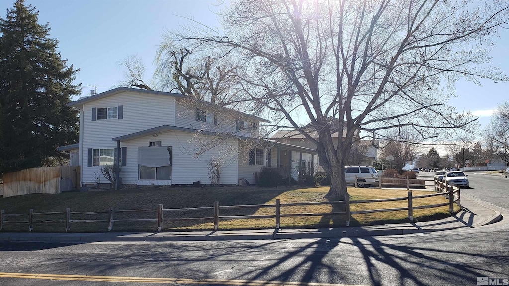 traditional home with a fenced front yard