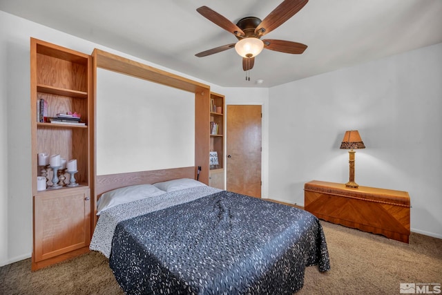 carpeted bedroom featuring ceiling fan and baseboards