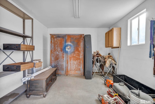 interior space featuring unfinished concrete flooring