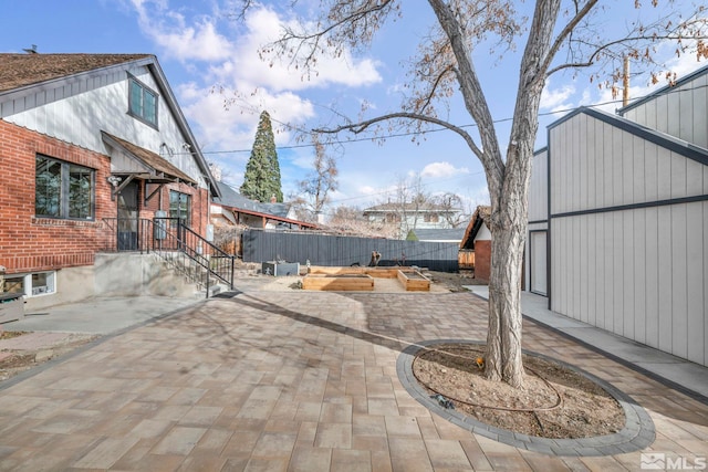 view of patio featuring fence