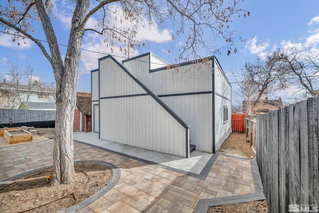 view of outdoor structure featuring a fenced backyard