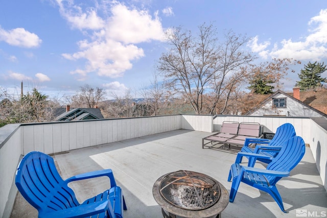 view of patio / terrace with an outdoor fire pit