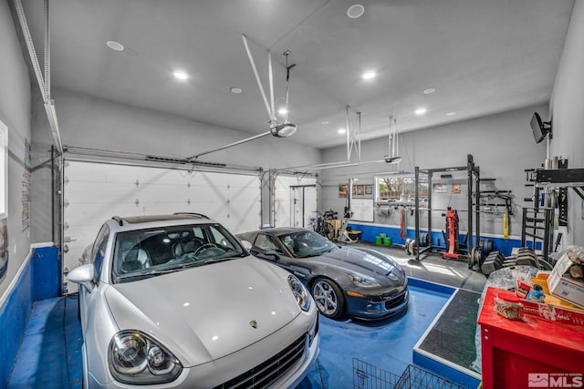 garage featuring a garage door opener and recessed lighting