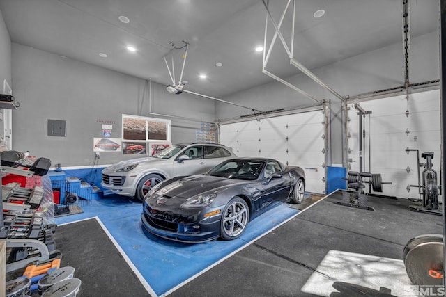 garage featuring electric panel and a garage door opener