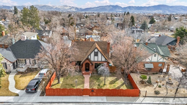 birds eye view of property with a residential view and a mountain view