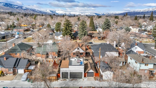 birds eye view of property with a residential view and a mountain view