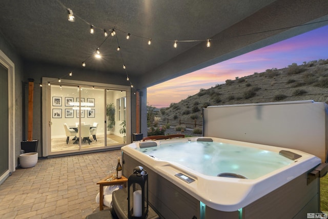 view of patio featuring a hot tub