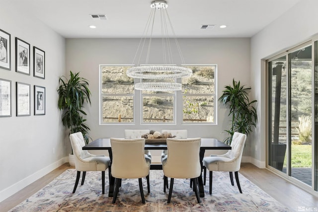 dining room featuring recessed lighting, visible vents, baseboards, and wood finished floors