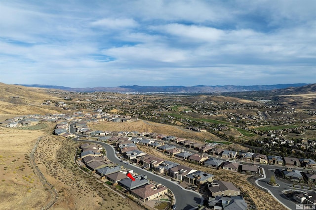 drone / aerial view featuring a residential view and a mountain view