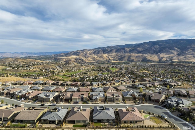 birds eye view of property with a residential view and a mountain view