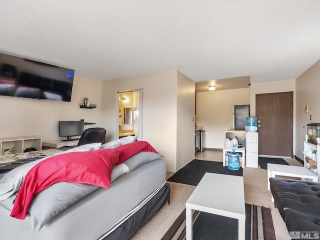 living area featuring a textured ceiling and carpet