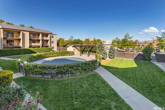 exterior space featuring a fenced in pool and fence