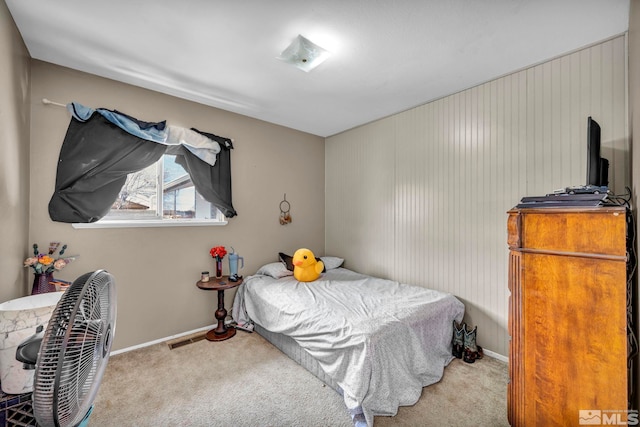 bedroom featuring carpet flooring and baseboards