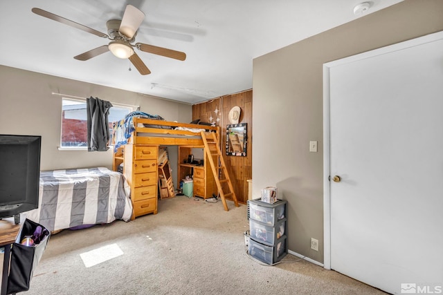 bedroom with ceiling fan and carpet