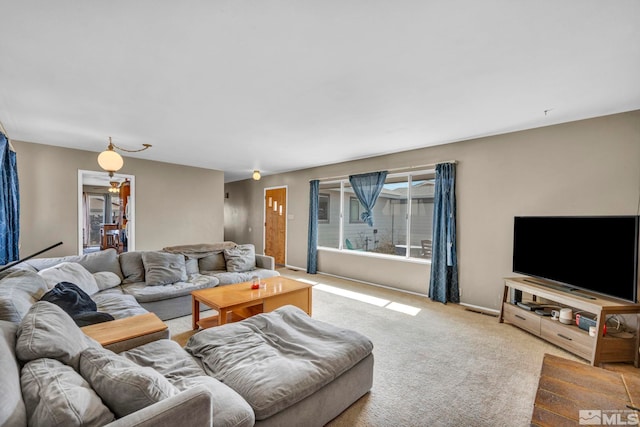 living room featuring visible vents and carpet flooring