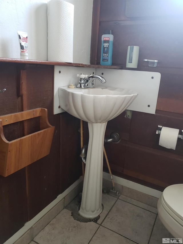 bathroom featuring tile patterned flooring and toilet