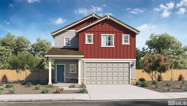 view of front of house with driveway, stone siding, an attached garage, fence, and board and batten siding