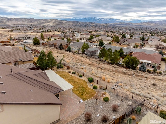 drone / aerial view with a residential view and a mountain view