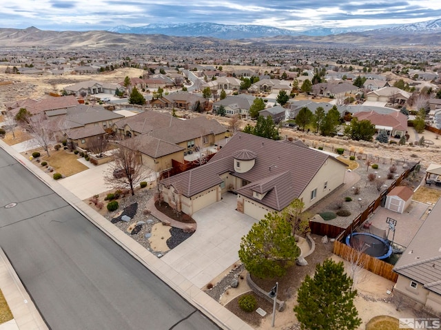 drone / aerial view featuring a mountain view and a residential view