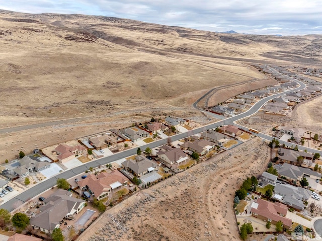 aerial view featuring a mountain view and a residential view