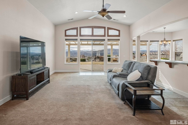 living room with visible vents, baseboards, light colored carpet, lofted ceiling, and ceiling fan with notable chandelier