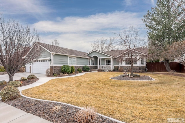 ranch-style house with stone siding, fence, and a front lawn