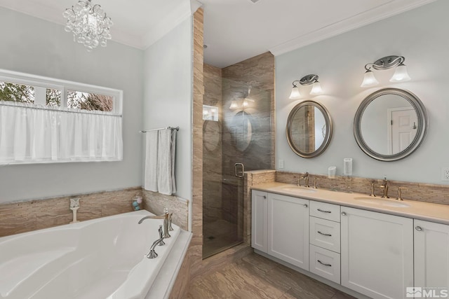 full bath with a garden tub, crown molding, a sink, and a stall shower