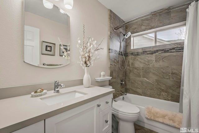 bathroom with toilet, shower / bath combo with shower curtain, and vanity